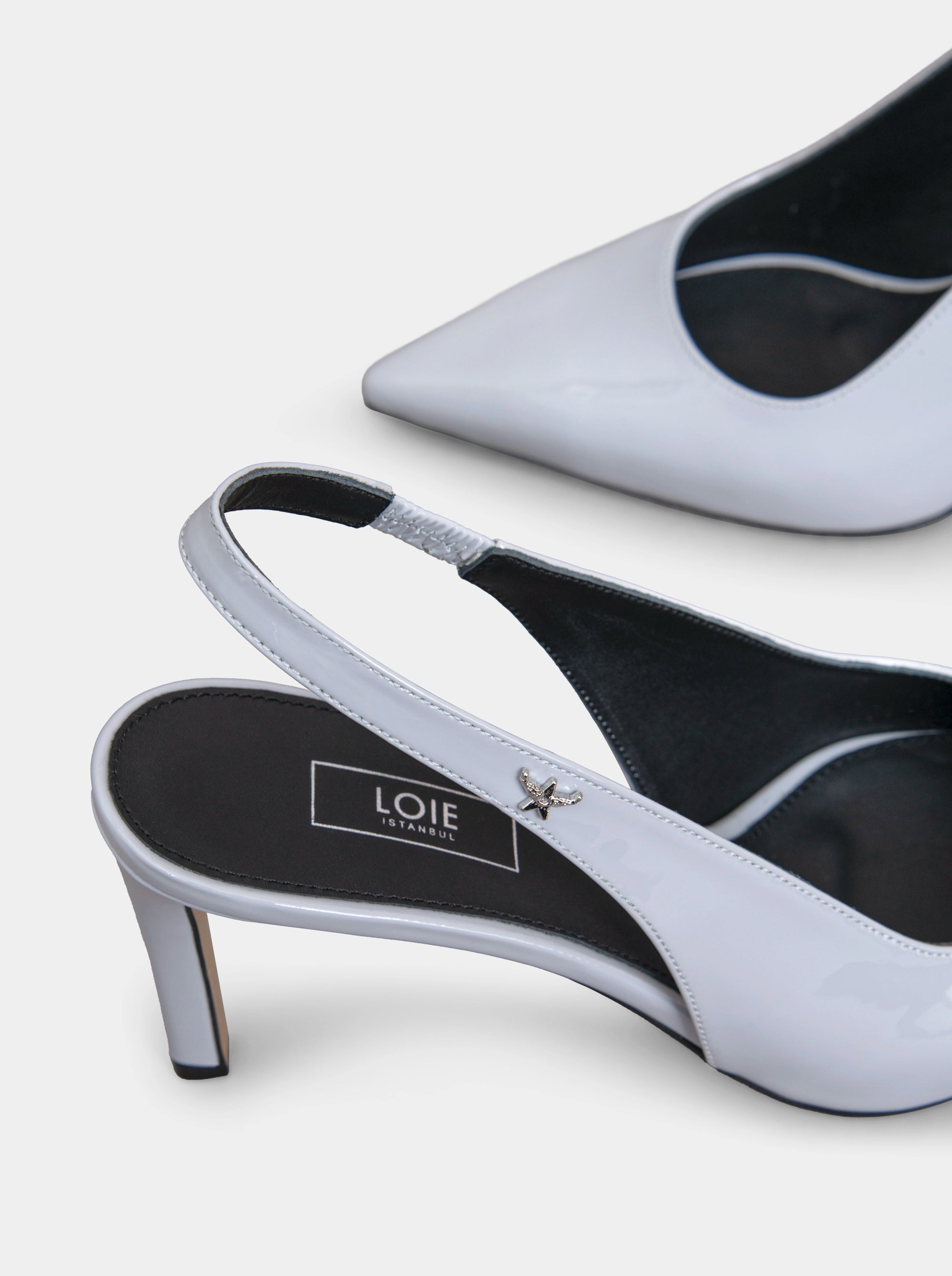 FORCE GREY PATENT PUMPS